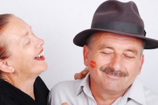 Senior couple kiss situation in white isolated background